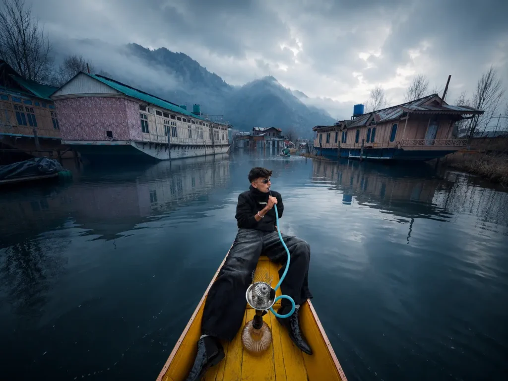 Freelance digital marketing expert in Dubai enjoying a shikara boat ride on Dal Lake in Kashmir during a travel experience